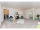 Spacious bonus room that leads to a laundry room and a doorway to another room at 1514 Starmount Cove Ln, Charlotte, NC 28210