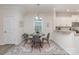 Bright dining area featuring modern decor and a view into the kitchen at 1514 Starmount Cove Ln, Charlotte, NC 28210