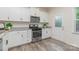 Modern kitchen with stainless steel appliances, stone countertops and stylish cabinetry at 1514 Starmount Cove Ln, Charlotte, NC 28210