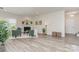 Bright living room featuring a cozy fireplace and modern hardwood floors at 1514 Starmount Cove Ln, Charlotte, NC 28210