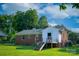 Brick home featuring a quaint rear entry, stairs, and fenced yard at 1617 Madison St, Rock Hill, SC 29732