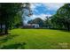 Expansive backyard featuring mature trees and a well-maintained lawn at 1617 Madison St, Rock Hill, SC 29732