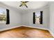 Bedroom with hardwood floors, light gray walls and natural light from windows at 1617 Madison St, Rock Hill, SC 29732