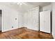 Cozy bedroom features wood floors, a painted brick accent wall, and a ceiling fan at 1617 Madison St, Rock Hill, SC 29732