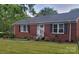 Charming brick ranch home with well-maintained landscaping, and a cozy front porch at 1617 Madison St, Rock Hill, SC 29732