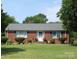 Charming brick ranch home with lush front yard and well-maintained landscaping at 1617 Madison St, Rock Hill, SC 29732