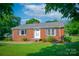 Well-maintained brick ranch-style home with a manicured lawn and classic design at 1617 Madison St, Rock Hill, SC 29732