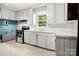 Bright kitchen features white cabinets, stainless steel appliances, and functional layout at 1617 Madison St, Rock Hill, SC 29732