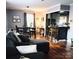 Inviting living room featuring hardwood floors, open layout, and breakfast bar at 1617 Madison St, Rock Hill, SC 29732