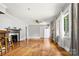 Spacious living room with hardwood floors, fireplace, and natural light from large windows at 1617 Madison St, Rock Hill, SC 29732