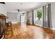 A open living room featuring hardwood floors, natural light, and bar with stools at 1617 Madison St, Rock Hill, SC 29732