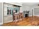 Living room boasts hardwood floors, a fireplace, and an unique wooden bar at 1617 Madison St, Rock Hill, SC 29732