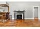 The home offers a cozy living room with hardwood floors, a fireplace, and bar at 1617 Madison St, Rock Hill, SC 29732