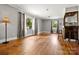 Open living room with wood floors, natural light, and a rustic wooden bar at 1617 Madison St, Rock Hill, SC 29732