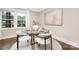 Modern dining room with round table and natural light, creating a cozy and inviting space at 1744 Emerywood Dr, Charlotte, NC 28210