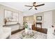 An open concept living room featuring hardwood floors, lots of natural light, and modern decor at 1744 Emerywood Dr, Charlotte, NC 28210