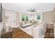 Cozy living room with a ceiling fan, hardwood floors, neutral tones, and plenty of natural light at 1744 Emerywood Dr, Charlotte, NC 28210
