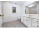 Bright bathroom featuring vinyl flooring, a modern vanity, and a window at 204 S Deerfield Cir, Salisbury, NC 28147