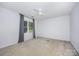 Bright bedroom featuring neutral carpet, a ceiling fan, and a window with natural light at 204 S Deerfield Cir, Salisbury, NC 28147