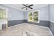 A blue dining room in need of floor repair at 204 S Deerfield Cir, Salisbury, NC 28147