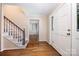The foyer features wood floors, staircase, and a view into another room at 204 S Deerfield Cir, Salisbury, NC 28147