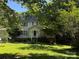 Traditional two-story home with a green lawn, mature trees, and a welcoming front porch at 204 S Deerfield Cir, Salisbury, NC 28147
