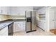 Traditional kitchen features stainless steel refrigerator and white cabinetry, offering ample storage at 204 S Deerfield Cir, Salisbury, NC 28147