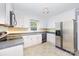 The kitchen features white cabinets and stainless steel appliances at 204 S Deerfield Cir, Salisbury, NC 28147