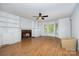 A well-lit living room with built-in shelving and a fireplace at 204 S Deerfield Cir, Salisbury, NC 28147
