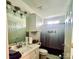 Bathroom features a shower-tub combination and vanity with plenty of storage at 222 Ross Moore Ave, Charlotte, NC 28205