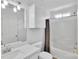 Modern bathroom features a vanity, toilet, and a shower-tub combo at 222 Ross Moore Ave, Charlotte, NC 28205