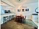 Cozy dining area with hardwood floors adjacent to the kitchen, perfect for Gathering meals at 222 Ross Moore Ave, Charlotte, NC 28205