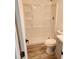 Bathroom featuring a walk-in shower and gray vanity with white sink and wood-look flooring at 2448 Cambridge Dr, Lancaster, SC 29720