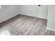 Freshly cleaned bedroom features new vinyl floors and a freshly painted door at 2448 Cambridge Dr, Lancaster, SC 29720