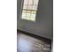 Bright bedroom with hardwood floors and a large window at 2448 Cambridge Dr, Lancaster, SC 29720