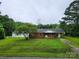 Charming single-story brick home with a well-maintained lawn and mature trees at 2448 Cambridge Dr, Lancaster, SC 29720