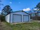 Two-car detached garage, metal siding, with ample parking and room for storage at 2448 Cambridge Dr, Lancaster, SC 29720