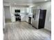 Well-lit kitchen featuring stainless steel appliances, white cabinetry, and modern countertops at 2448 Cambridge Dr, Lancaster, SC 29720