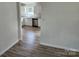 View of kitchen with white cabinets and stainless steel appliances from an adjacent living space at 2448 Cambridge Dr, Lancaster, SC 29720