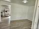 Bright living room with light-colored wood floors and a glimpse into the kitchen area at 2448 Cambridge Dr, Lancaster, SC 29720