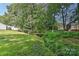 Backyard with a small foot bridge crossing over a creek at 2706 Bremer Ct, Charlotte, NC 28210
