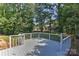 Backyard deck overlooking a lush green space and neighboring homes at 2706 Bremer Ct, Charlotte, NC 28210