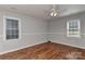 Bedroom filled with natural light, hardwood floors, neutral walls, and a ceiling fan at 2706 Bremer Ct, Charlotte, NC 28210
