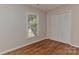 This is a bedroom with hardwood floors, closet and a window offering ample natural light at 2706 Bremer Ct, Charlotte, NC 28210