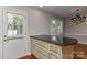 Bright dining room area featuring hardwood floors and custom cabinetry at 2706 Bremer Ct, Charlotte, NC 28210