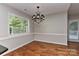 Inviting dining room featuring neutral walls, hardwood floors and natural light at 2706 Bremer Ct, Charlotte, NC 28210