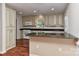 Bright kitchen with custom cabinets, granite counters, and hardwood floors at 2706 Bremer Ct, Charlotte, NC 28210