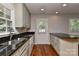 Lovely kitchen with stainless steel sink and dishwasher with backyard view at 2706 Bremer Ct, Charlotte, NC 28210