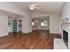 Open living space featuring hardwood floors with view to kitchen and dining areas at 2706 Bremer Ct, Charlotte, NC 28210