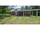 Expansive backyard featuring lush greenery, a car port, and convenient access at 2828 Bellhaven Cir, Charlotte, NC 28214
